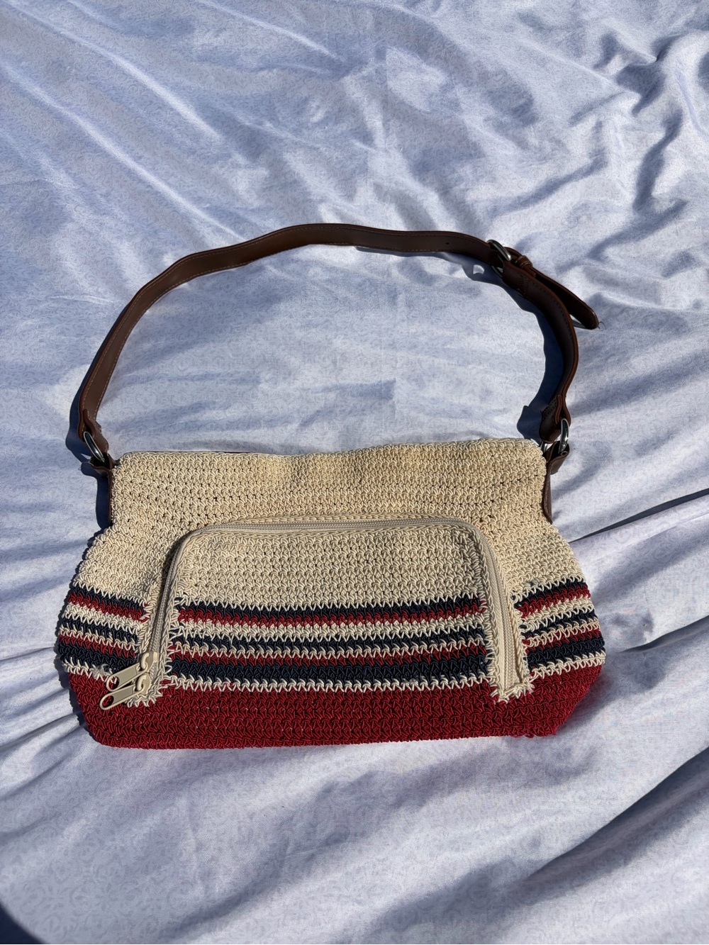 Woven tan red and blue purse